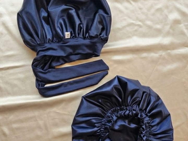 Navy satin VELARÉ wrap bonnet and elastic bonnet on champagne fabric